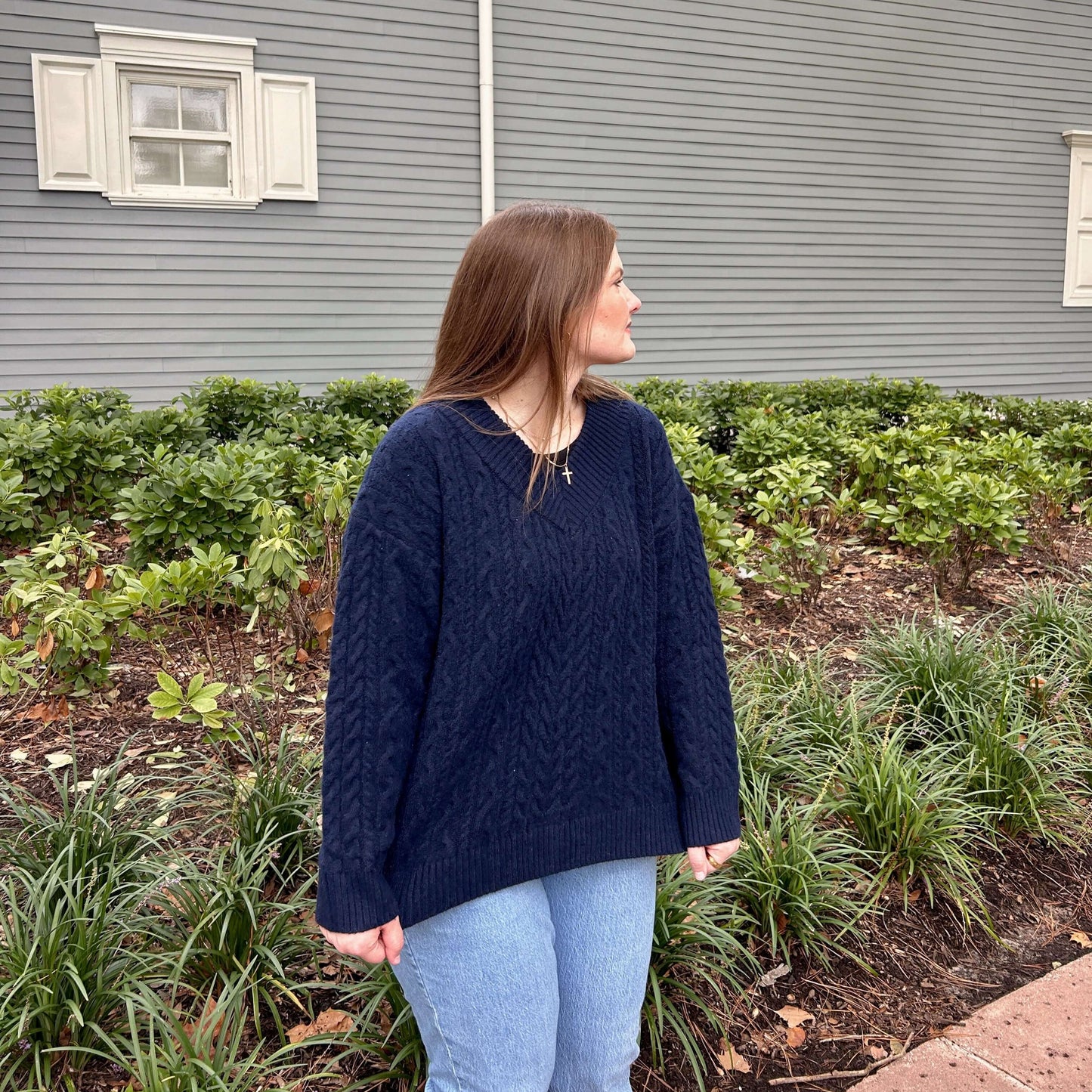 V-neck cable knit sweater front