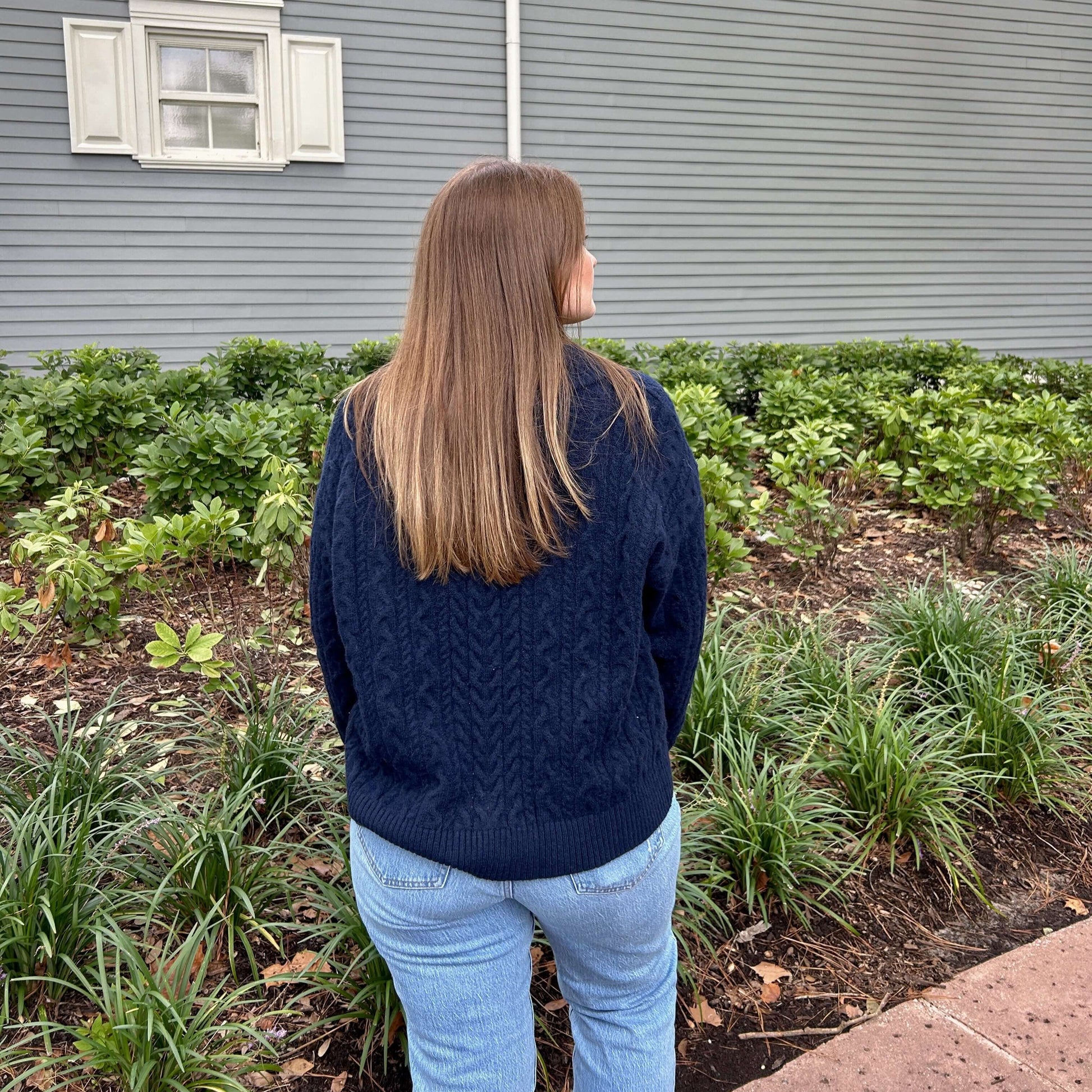 V-neck cable knit sweater back