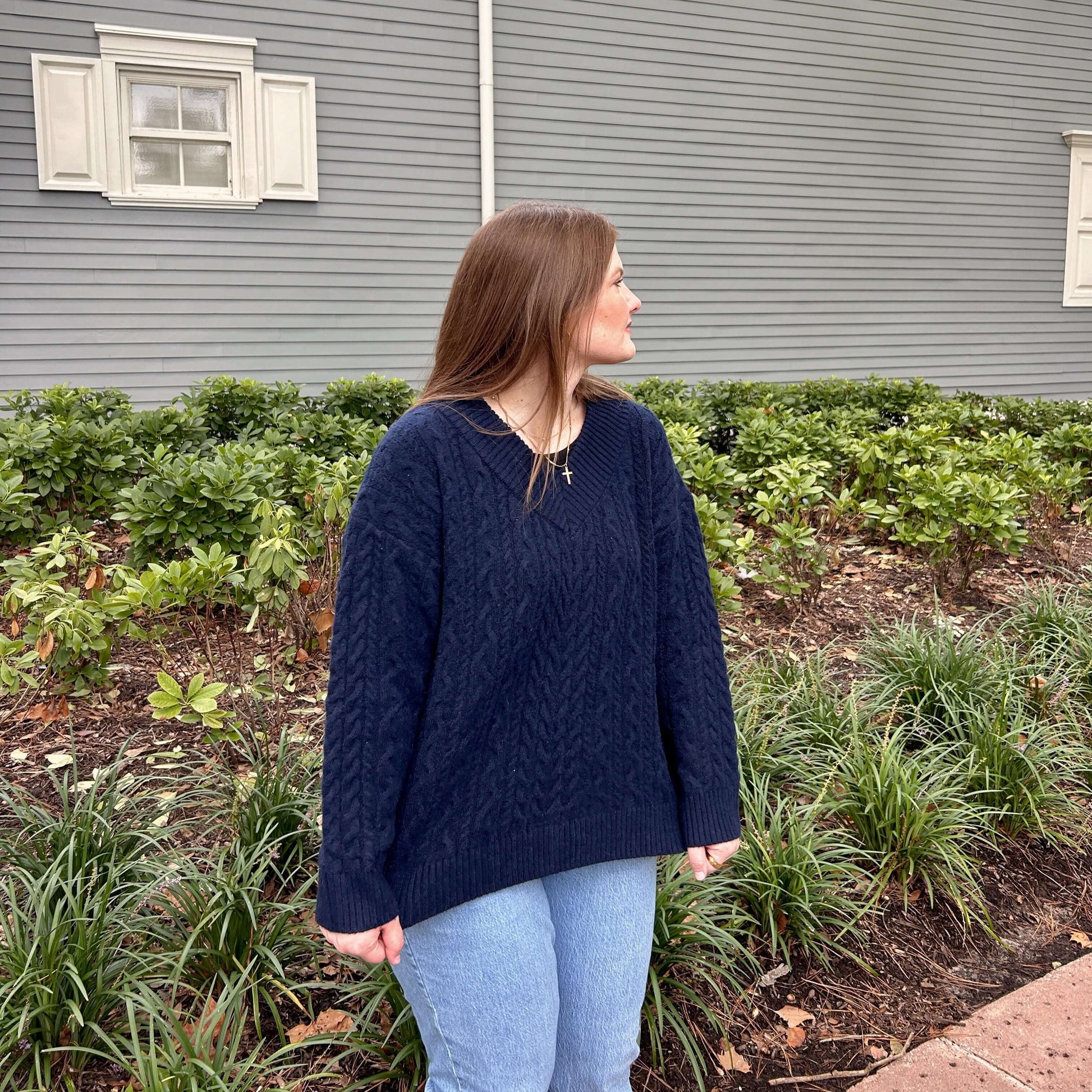 V-neck cable knit sweater front